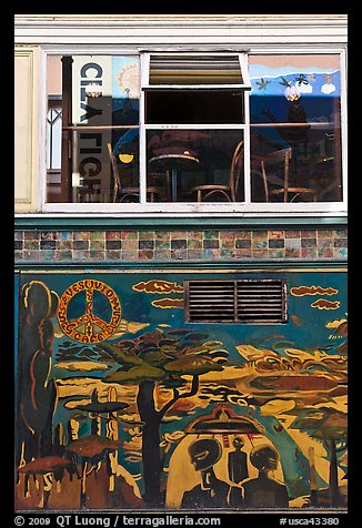 Decor from beatnik period and window reflecting city light sign, North Beach. San Francisco, California, USA