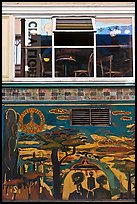 Decor from beatnik period and window reflecting city light sign, North Beach. San Francisco, California, USA (color)