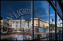 City Light Bookstore window glass and city reflections, North Beach. San Francisco, California, USA