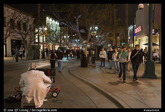 People walking past mime on Third Street Promenade. Santa Monica, Los Angeles, California, USA