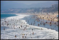 Many people bathing in surf at Santa Monica Beach. Santa Monica, Los Angeles, California, USA (color)