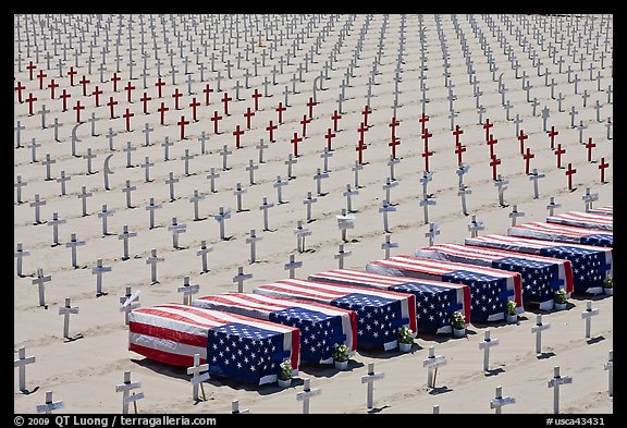 Flag draped coffins and crosses, Santa Monica beach. Santa Monica, Los Angeles, California, USA (color)