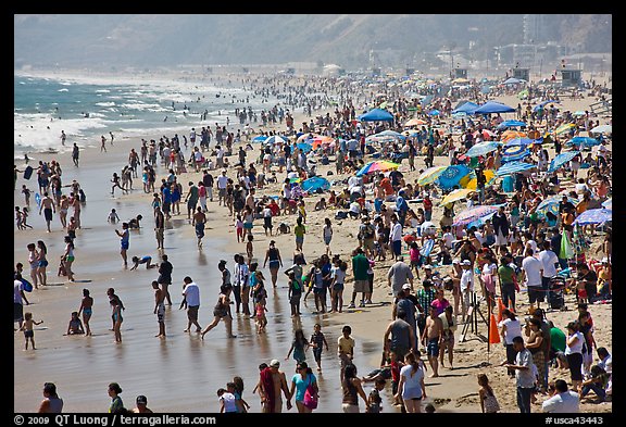 Dense crowds on beach. Santa Monica, Los Angeles, California, USA (color)