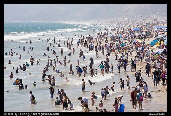 Crowds of beachgoers in water. Santa Monica, Los Angeles, California, USA (color)