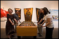 Playing soccer table game in art gallery, Bergamot Station. Santa Monica, Los Angeles, California, USA