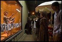 People watch performance artists in window, Bergamot Station. Santa Monica, Los Angeles, California, USA