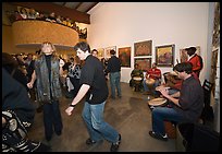 Guest dance to drums on art gallery opening night, Bergamot Station. Santa Monica, Los Angeles, California, USA