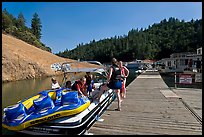 Deck with family preparing a boat, Shasta Lake. California, USA ( color)