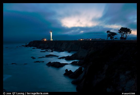 Coastal bluff with lighthouse at dusk, Point Arena. California, USA