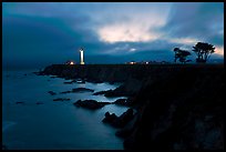 Coastal bluff with lighthouse at dusk, Point Arena. California, USA