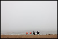 Sitting in front of foggy ocean, Manchester State Park. California, USA