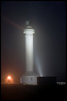 Point Arena Lighthouse on foggy night. California, USA