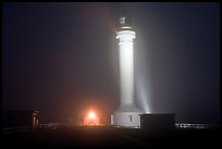 Fog and Point Arena Lighthouse by night. California, USA