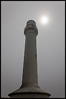 Point Arena Lighthouse and sun through fog. California, USA