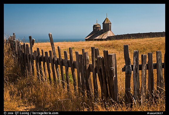 Fences, summer grass and chapel towers, Fort Ross. Sonoma Coast, California, USA (color)