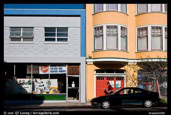 Street with brighly painted buildings, Mission District. San Francisco, California, USA (color)