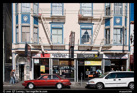 Buildings, cars, and sidewalk, Mission Street, Mission District. San Francisco, California, USA (color)