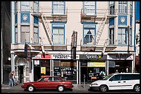 Buildings, cars, and sidewalk, Mission Street, Mission District. San Francisco, California, USA