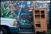 Car, mural, and discarded furniture, Mission District. San Francisco, California, USA ( color)