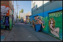Alley (Lilac) with many murals and decorated garage doors, Mission District. San Francisco, California, USA (color)