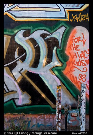 Posts and painted wall detail, Mission District. San Francisco, California, USA