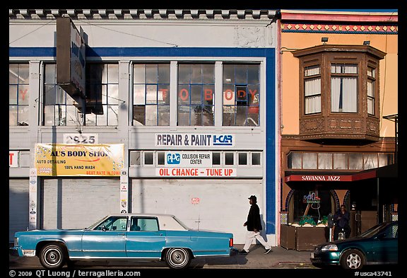 Old car and sidewalk, Mission Street, Mission District. San Francisco, California, USA