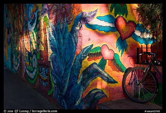 Bicycle and last light on mural, Mission District. San Francisco, California, USA