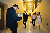 Soon to be maried couple and witness in City Hall corridor. San Francisco, California, USA (color)