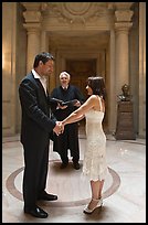 Bride, groom, and wedding officant, City Hall. San Francisco, California, USA ( color)