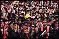 Graduating students wave to family and friends, commencement. Stanford University, California, USA