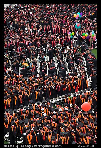 Dense rows of graduating college students in academic heraldy. Stanford University, California, USA
