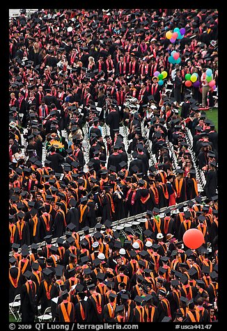 Dense rows of graduating college students in academic heraldy. Stanford University, California, USA