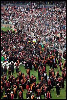 Graduates gather in front of family and friends after commencement. Stanford University, California, USA (color)