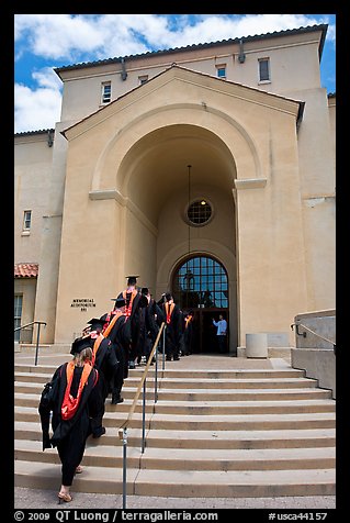 Graduating students in academic robes walk into Memorial auditorium. Stanford University, California, USA (color)