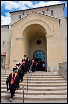 Graduating students in academic robes walk into Memorial auditorium. Stanford University, California, USA