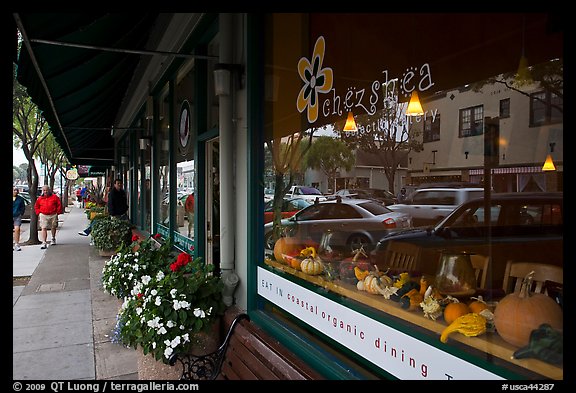 Main street reflected in storefront. Half Moon Bay, California, USA