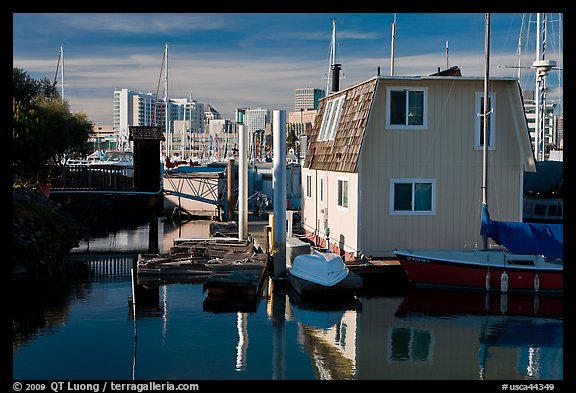 Houseboat and Oakland skyline. Oakland, California, USA (color)