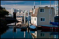 Houseboat and Oakland skyline. Oakland, California, USA (color)