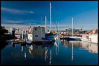 Alameda Houseboats and Oakland skyline. Oakland, California, USA