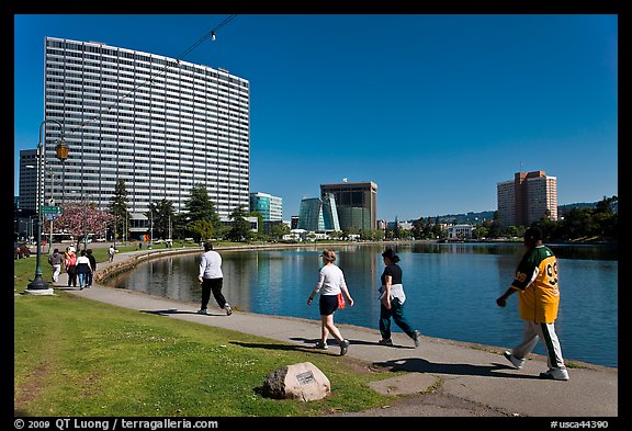 People strolling around 3.5 mile path around Lake Merritt. Oakland, California, USA