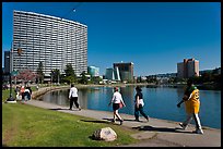 People strolling around 3.5 mile path around Lake Merritt. Oakland, California, USA (color)