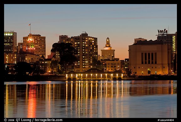 Downtown skyline accross Lake Merritt at dusk. Oakland, California, USA