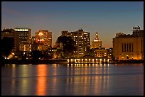 Oakland skyline reflected in Lake Merritt at night. Oakland, California, USA ( color)