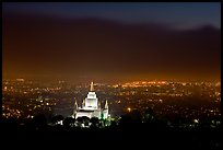 Oakland temple above the Bay by night. Oakland, California, USA