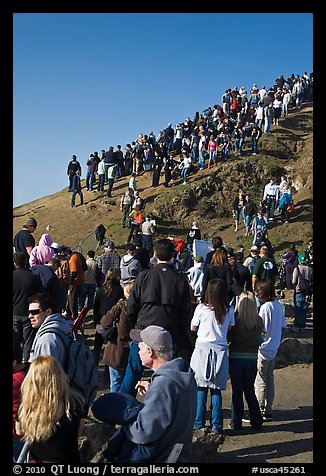 Spectators on bluff during mavericks contest. Half Moon Bay, California, USA (color)