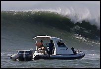 Small boat dwarfed by huge wave. Half Moon Bay, California, USA ( color)