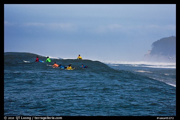 Surfers waiting for wave at Mavericks. Half Moon Bay, California, USA (color)