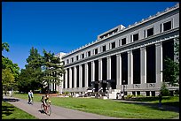 Students biking in front of Life Sciences building. Berkeley, California, USA (color)