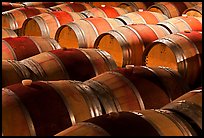 Rows of wine barrels in cellar, close-up. Napa Valley, California, USA (color)