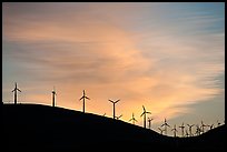 Wind farm silhouetted on hill, Altamont. California, USA